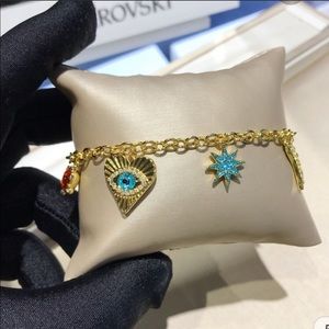 Swarovski Lucky Goddess gold tone charm bracelet